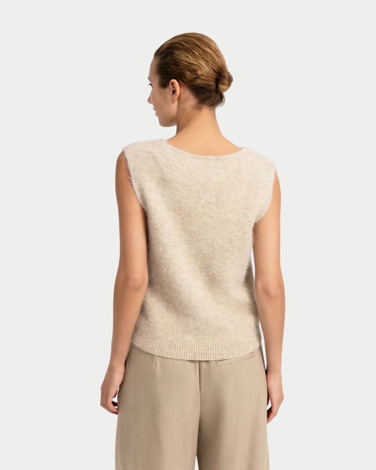 Sleeveless top with deep V-neck