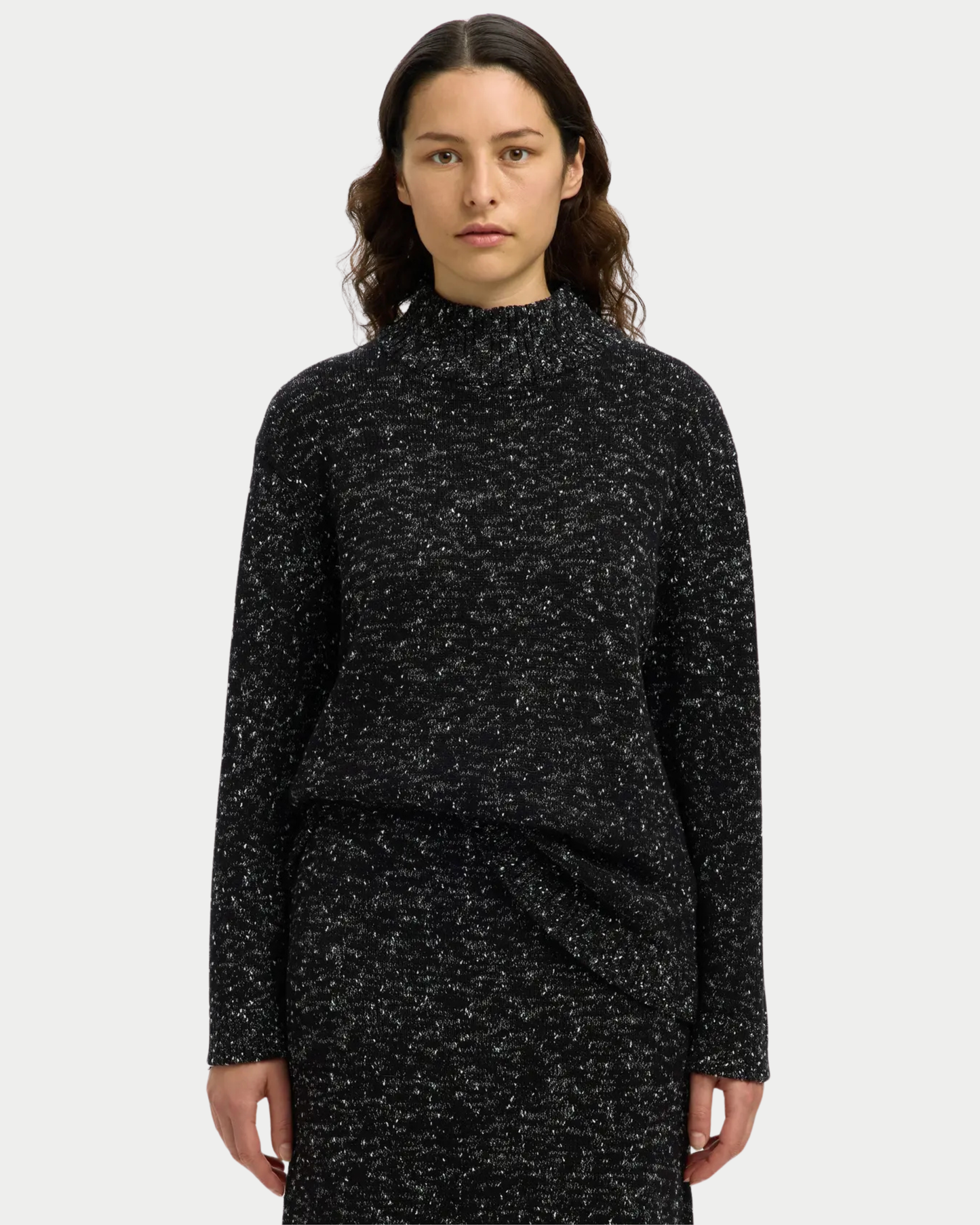 Maglia in maglia traforata a collo alto