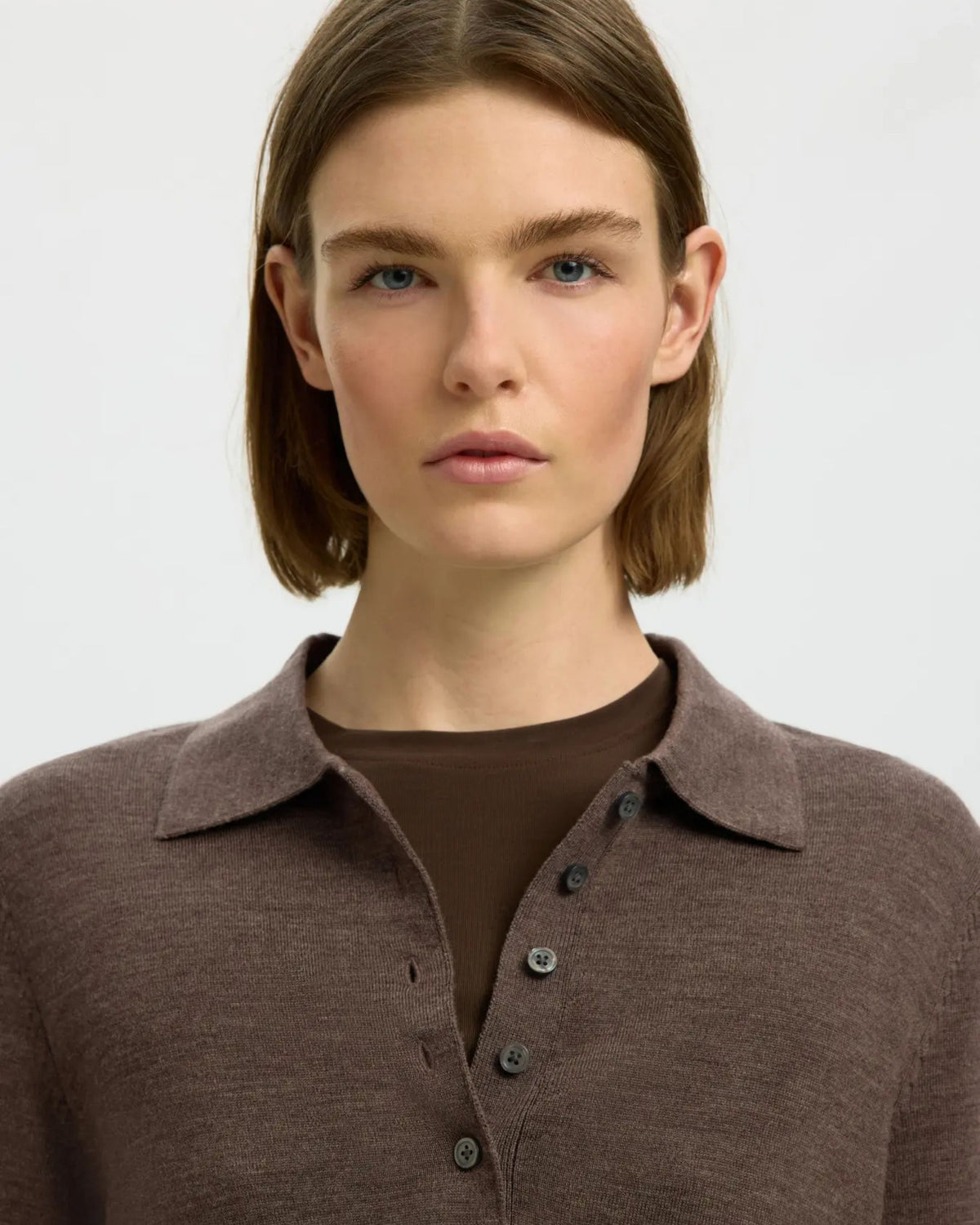 Polo in maglia di lana merino a maniche lunghe