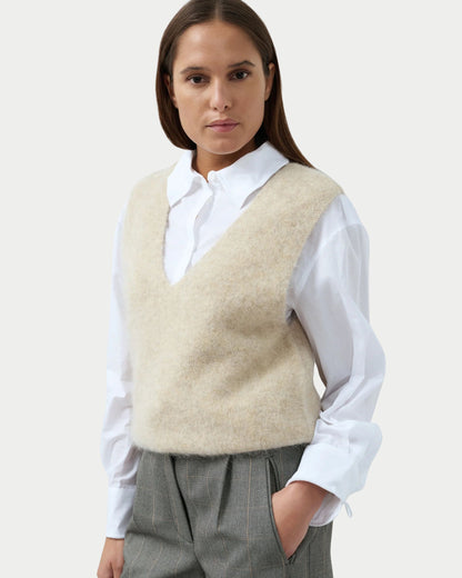 Sleeveless top with deep V-neck